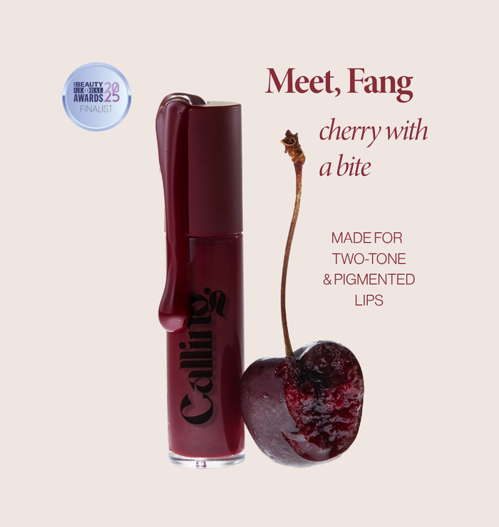 Mega Bite Tinted Jelly Lip Oil in Fang, a deep cherry red, with applicator. Pure Beauty Global Awards 2025 finalist